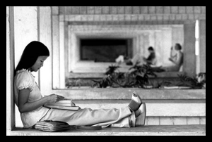 Bach Phuong Thi Pham, international student from Vietnam, reading outside at the Miami-Dade Community College south campus: Kendall, Florida (1977)